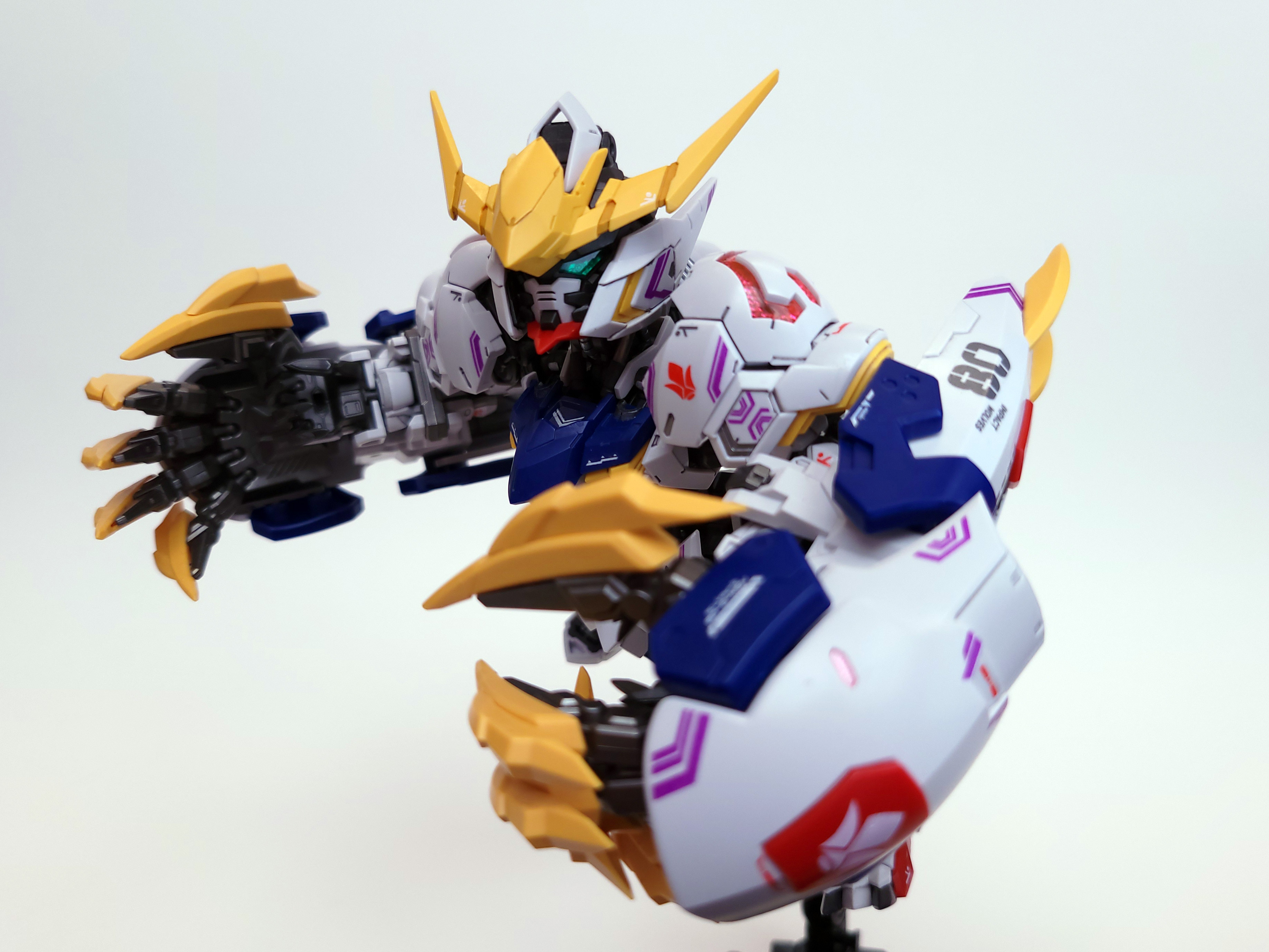 Barbatos is diving toward the frame, massive claw gauntlets prepped to tear