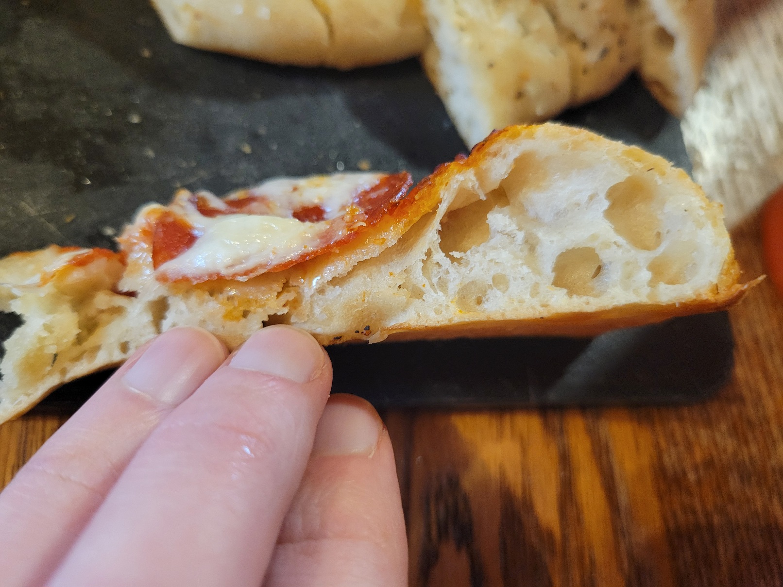 a bubbly profile shot of the above pizze