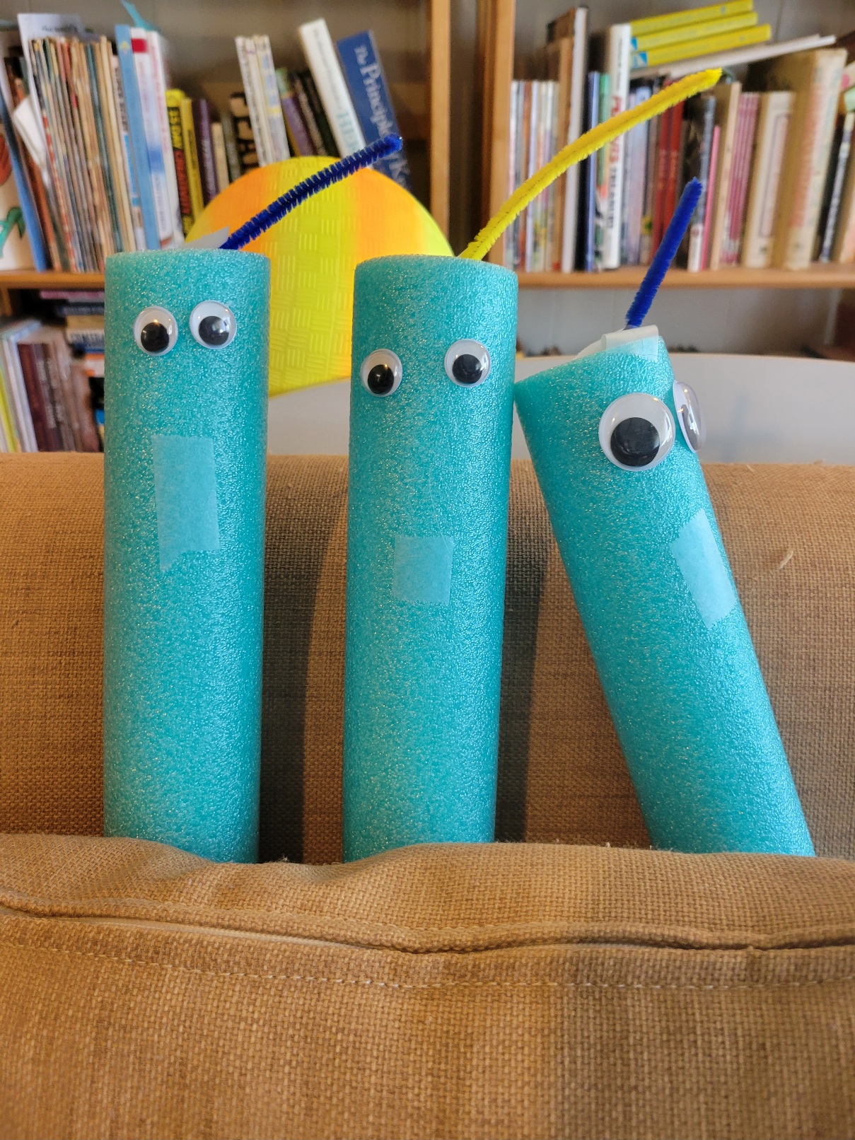 a close up of the other three worms. All have two eyes, one antenna, and a tape mouth