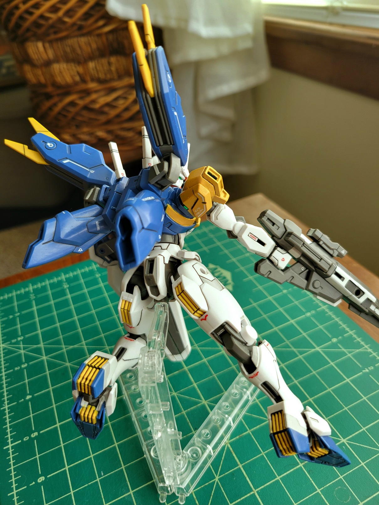 my painted rebuild, seen from behind in a flying pose. There are bright splashes of yellow on various vents and one shoulder is entirely yellow