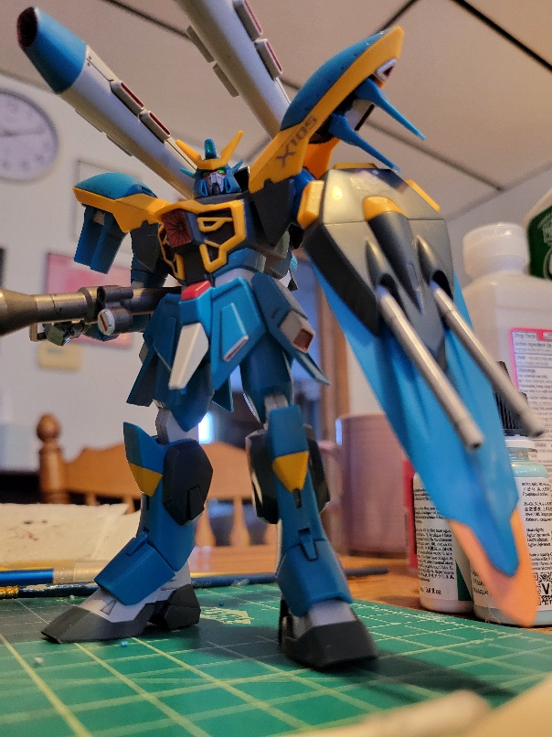 A forward facing photo of the HG Calamity Gundam model. The model has been subtly color matched to the anime colors