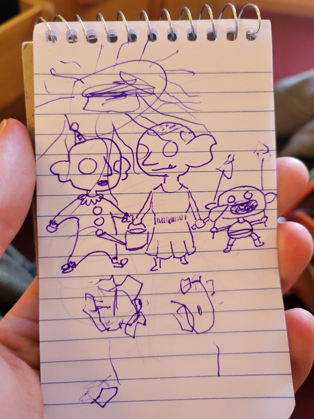 a purple gelpen doodle of three goblins under a shaky sun. One goblin is a clown, one has gardening equipment, and one is a baby clutching shaky flowers. There are two shaky flowers under the goblins plus one wobbly mushroom