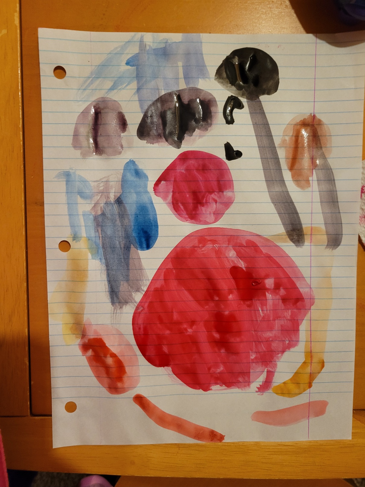 A painting of the solar system in bright watercolors. The planets are mishapen. Most have long tails curving out from them. A large red circle dominates the page, slightly off center