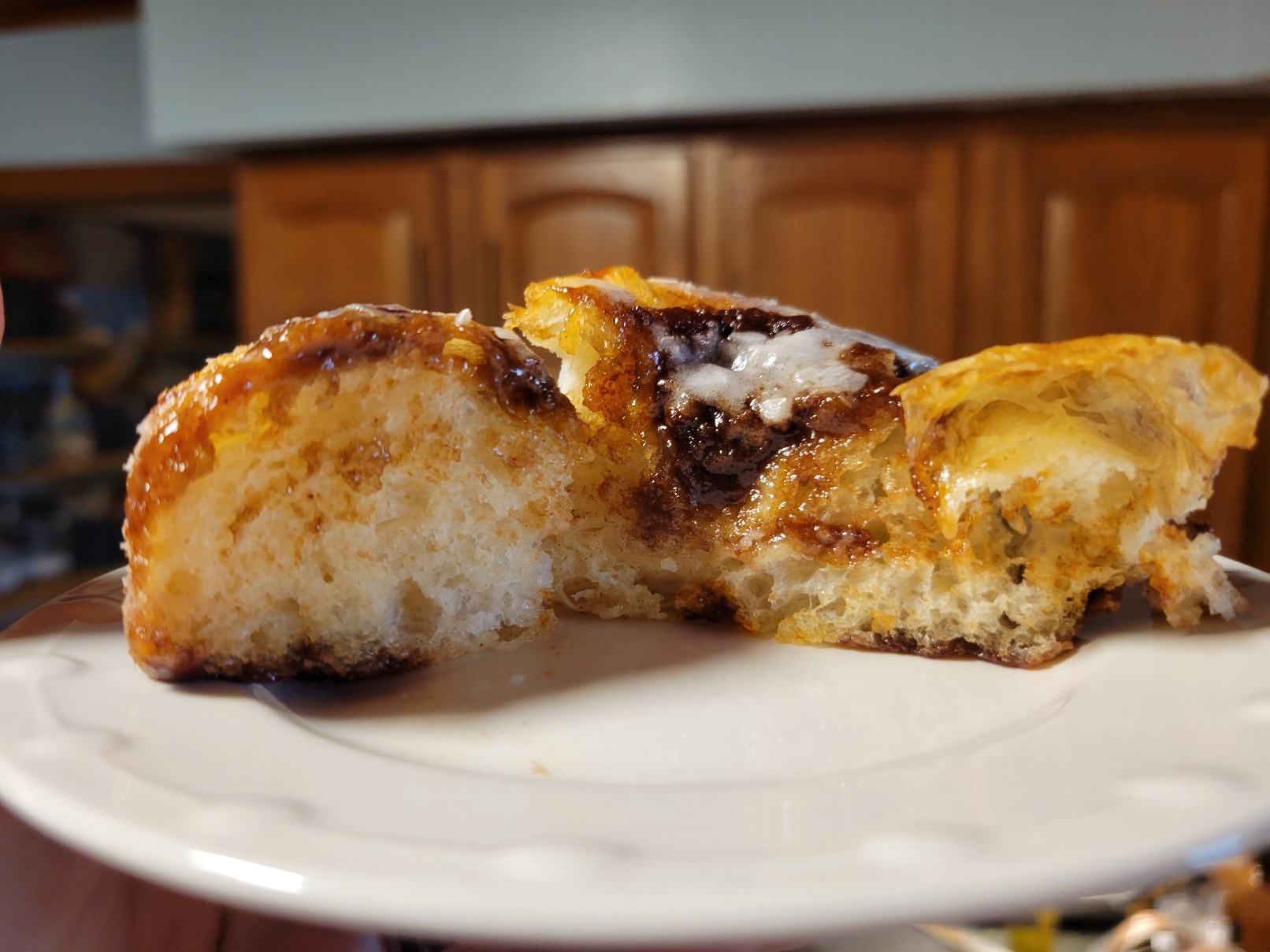 A profile view of the first slice, cut while the bread was still hot. The warm cinnamon sugar topping glistens