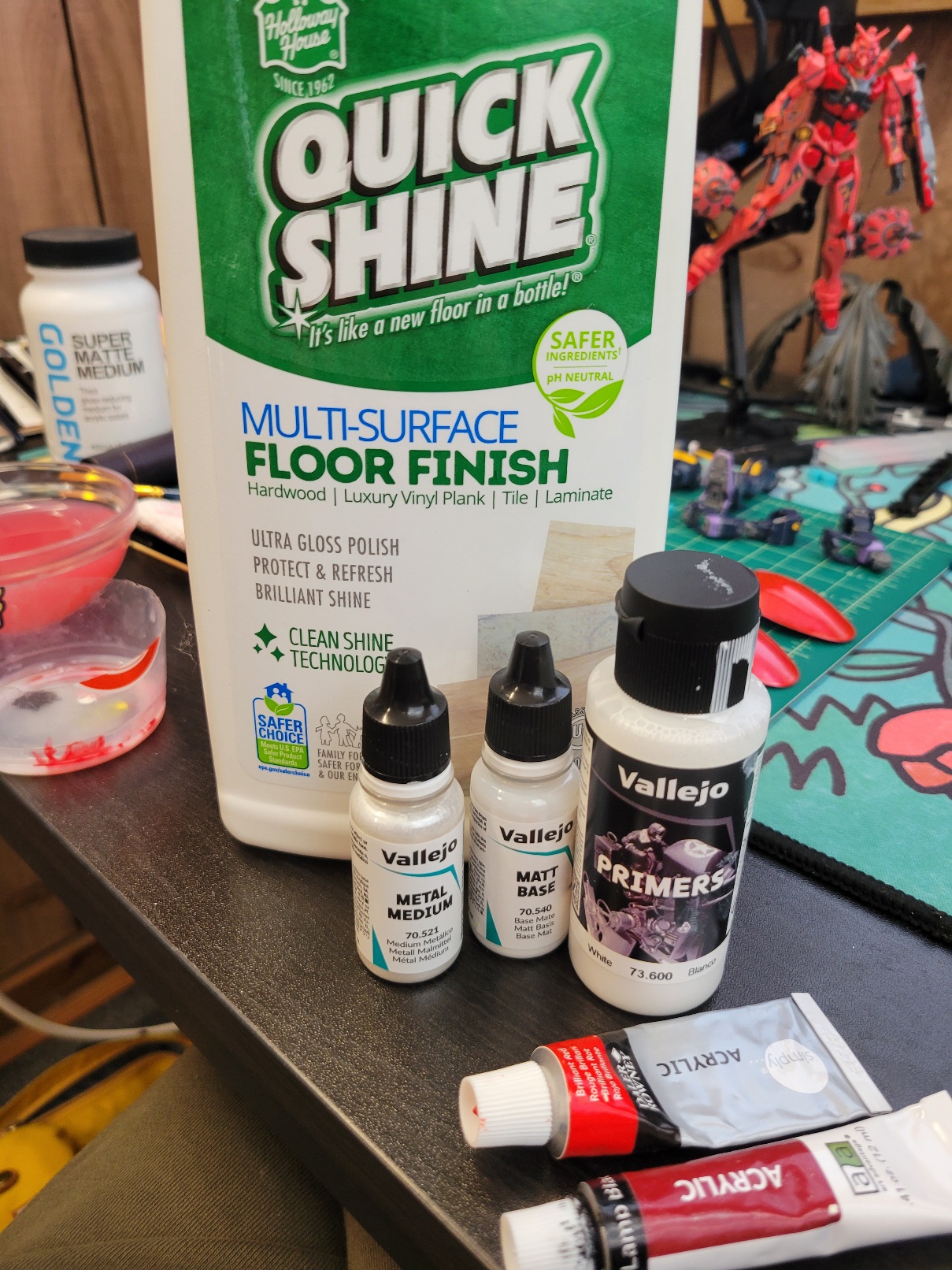 Materials used in painting: quickshine multi-surface floor polish, vallejo metal medium, vallejo matt base, vallejo primer, and tubes of cheap artist's acrylic paint